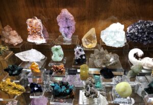 Rocks displayed on glass shelves