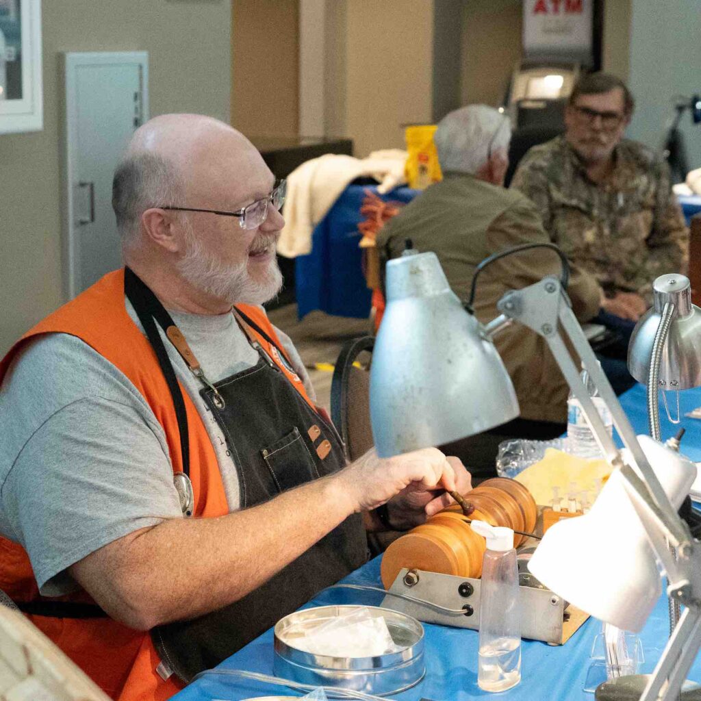 Steve WIlkerson demonstrating spool polishing at Demo Table
