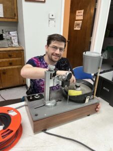man faceting gemstone